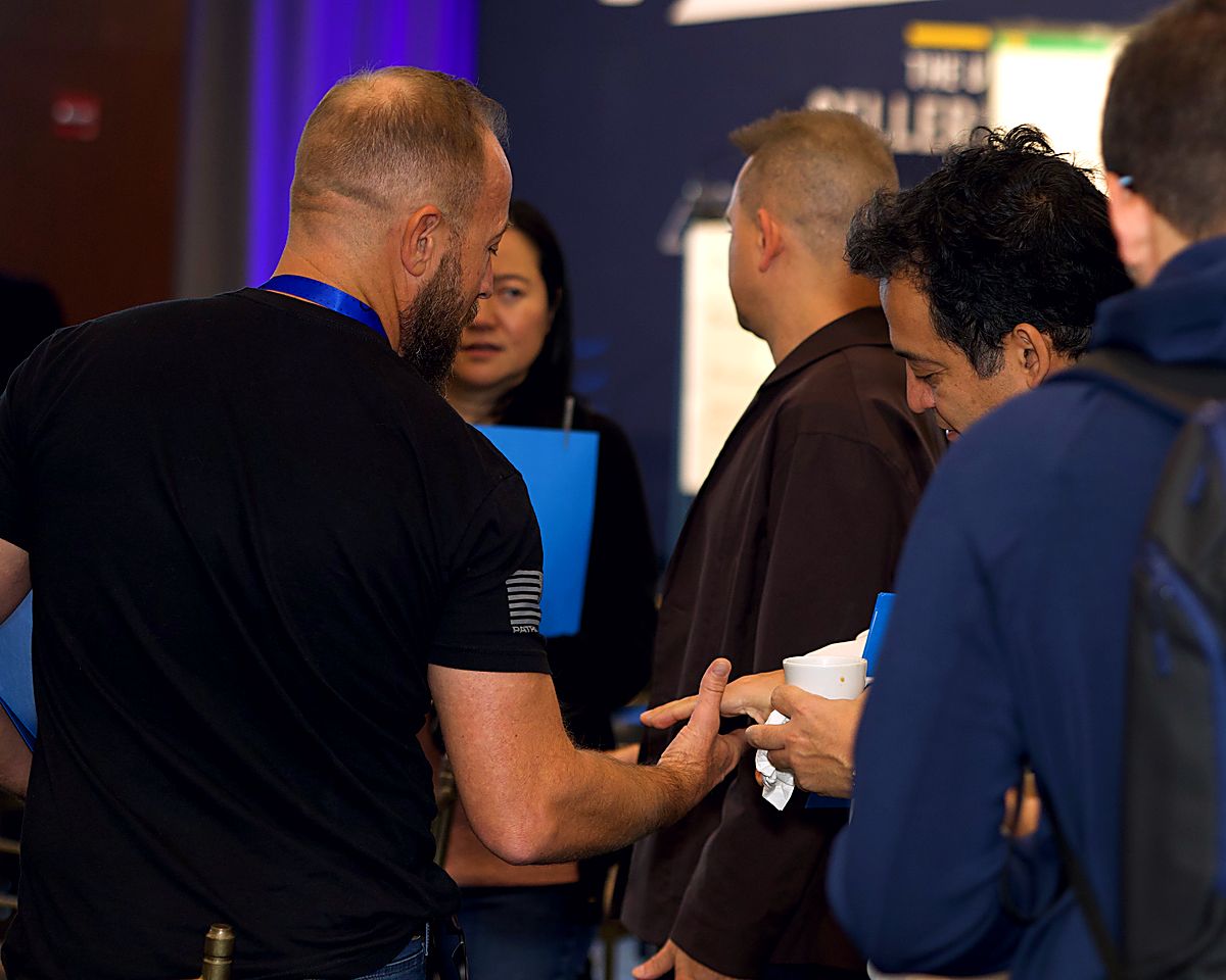 Attendees having a face-to-face conversation at Innovate